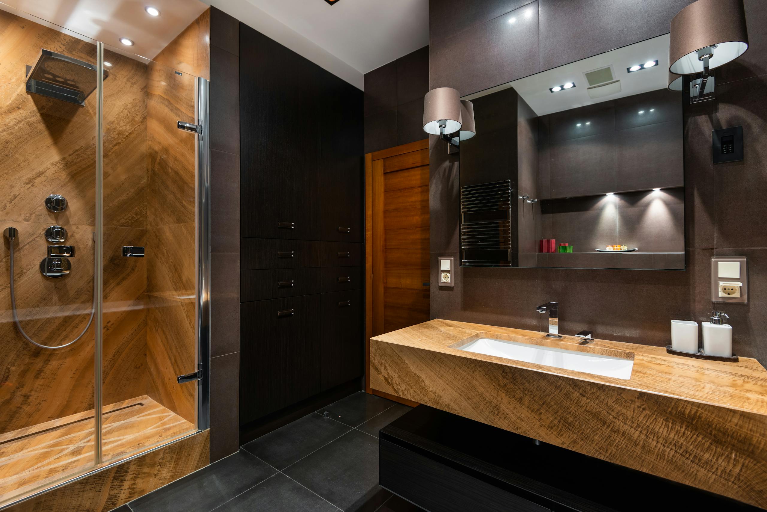 Stunning modern bathroom interior with wooden accents and contemporary fixtures, offering a luxurious and spacious feel.